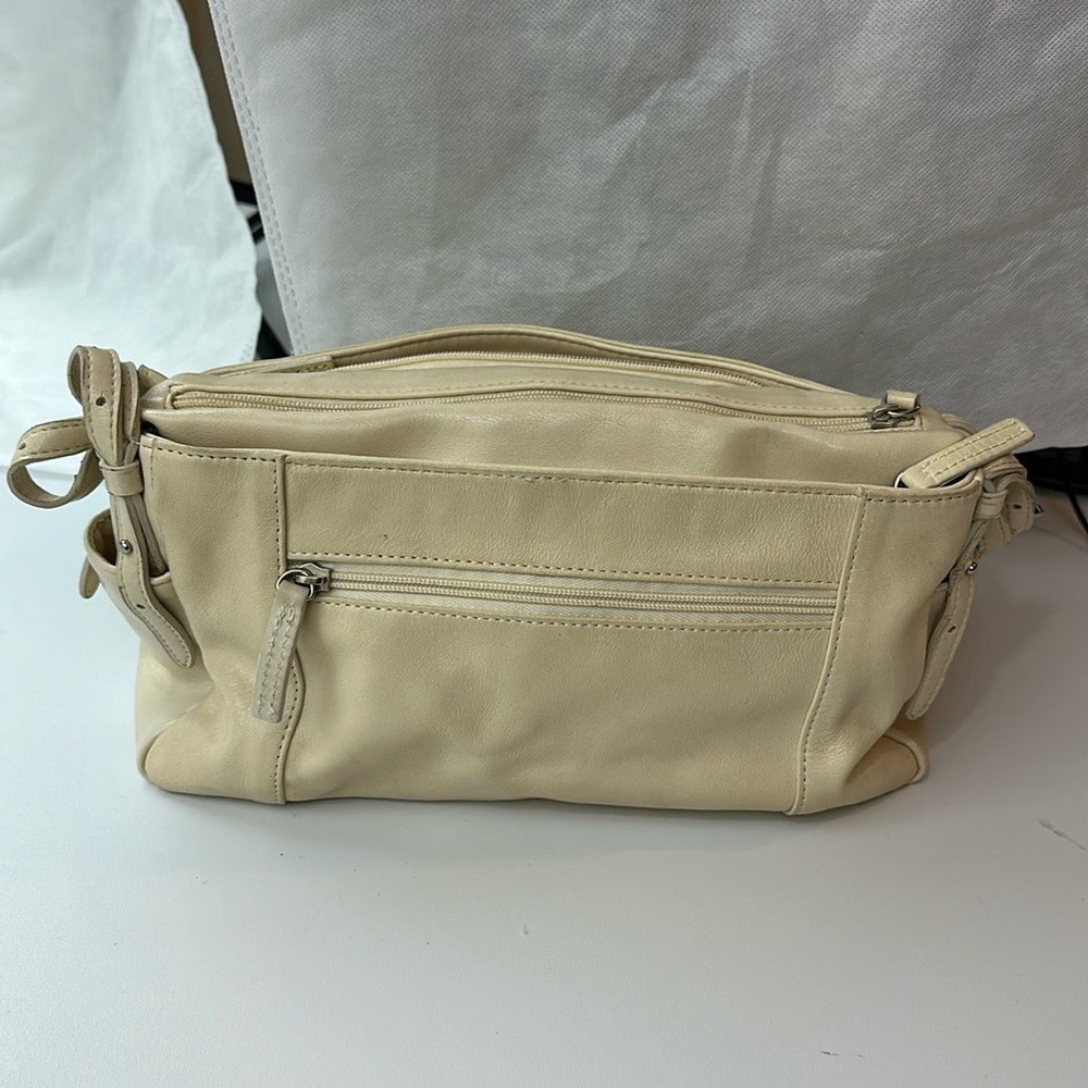 Used - Aurielle cream colored shoulder purse with multiple pockets.